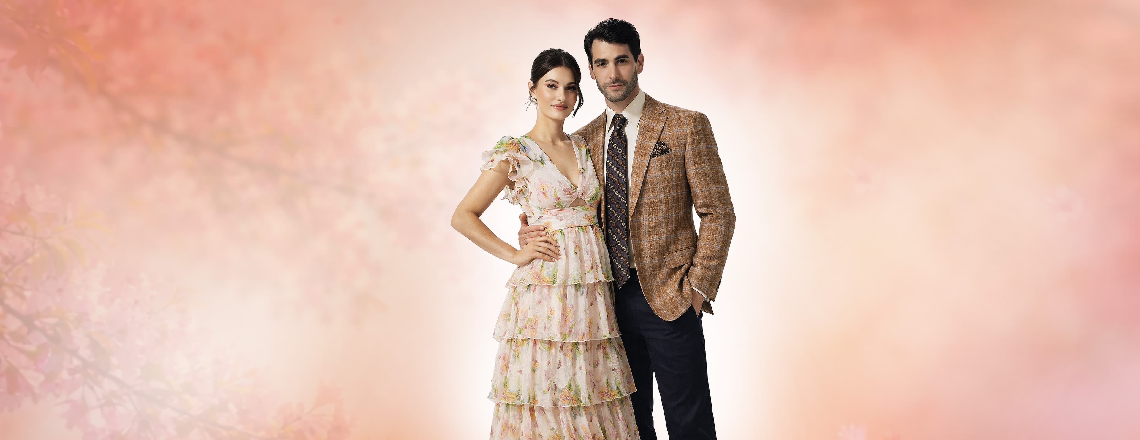 Elegant fashion couple in sophisticated attire - a man and woman showcasing luxury fashion in a premium setting with the Barcelino brand message 'It's a Visual World, All Eyes On You'