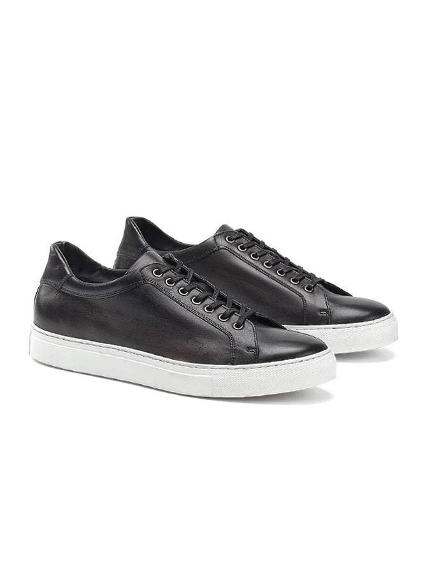 Black leather sneaker with white sole and black laces