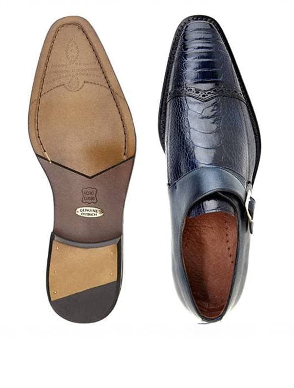 Top view of a men’s navy ostrich leather loafer with silver buckle and leather sole shown beside it, displaying both upper design and sole craftsmanship.