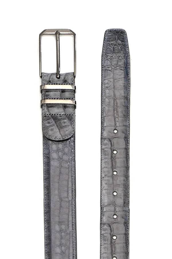 A Grey crocodile leather belt with a polished, textured finish, featuring a sleek silver buckle and double loops for added style and functionality. The rich grey color and exotic crocodile pattern add a luxurious touch to any outfit.