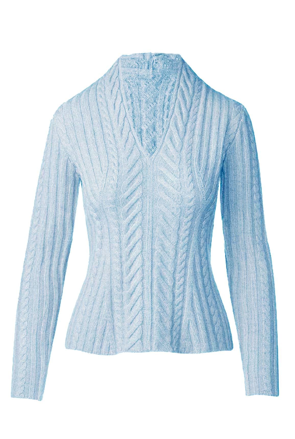 A light blue cable-knit sweater with a V-neck design and long sleeves.