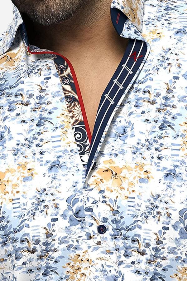 Close view of a printed leaves and flowers shirt, in shades of blue and yellow.