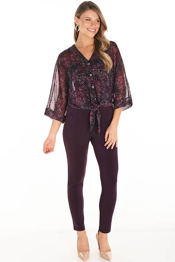 Close-up front view of a woman wearing high-waisted, slim-fit wine-colored pants. The pants feature a clean, tailored look with no buttons