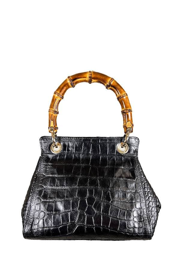 Back view of a Black crocodile-embossed leather handbag with a bamboo handle
