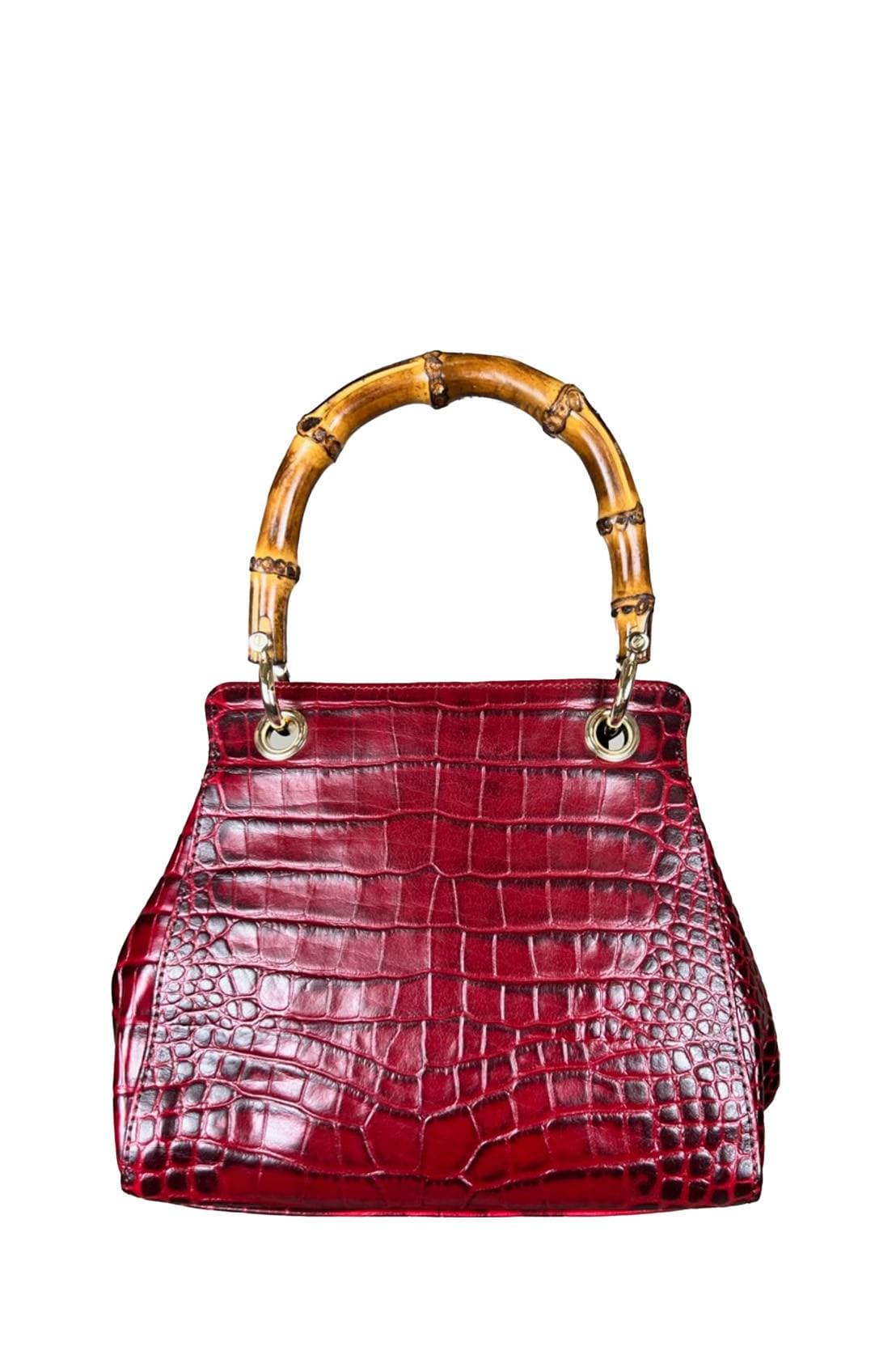 Back view of structured handbag in glossy deep red crocodile-embossed leather with a bamboo top handle, gold-tone clasp, and matching red leather luggage tag.
