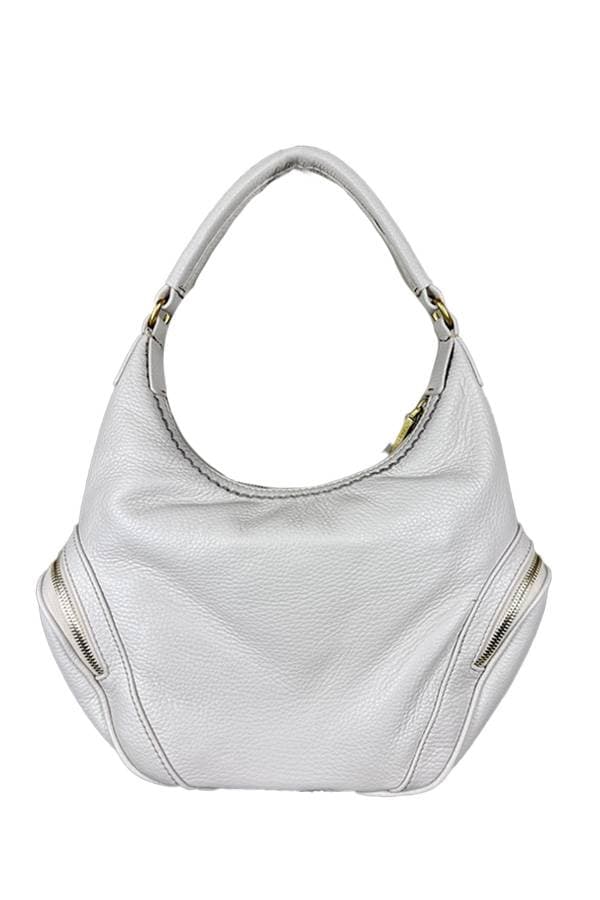 Back view of White handbag with a single handle, gold zipper accents on both sides, and a spacious slouchy body.