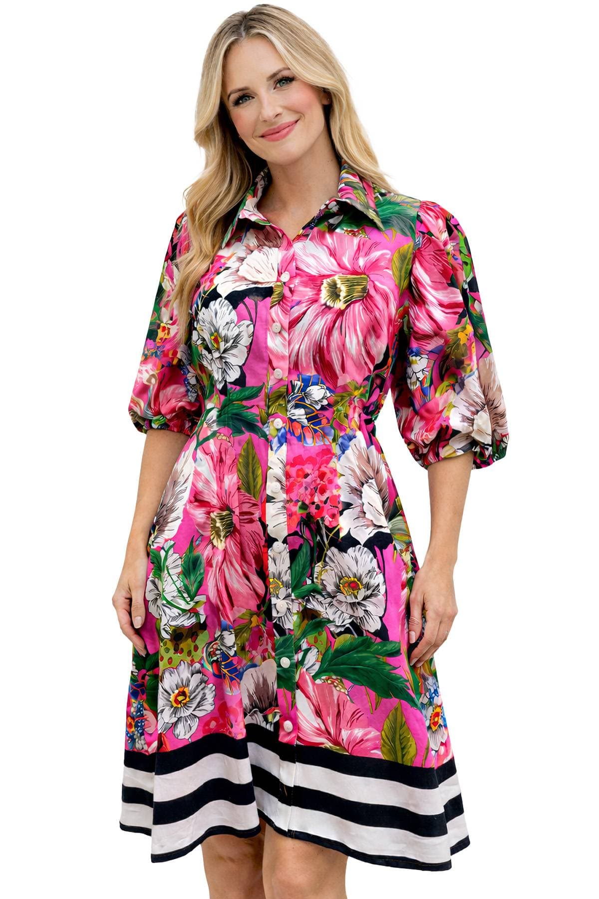 A person wearing a vibrant floral dress with puffed sleeves and a striped hem.