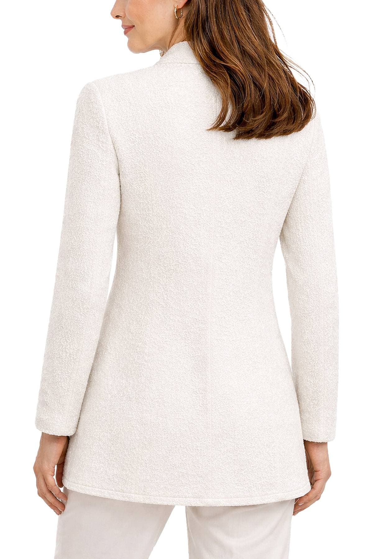 A person wearing a textured white coat with long sleeves, seen from the back.