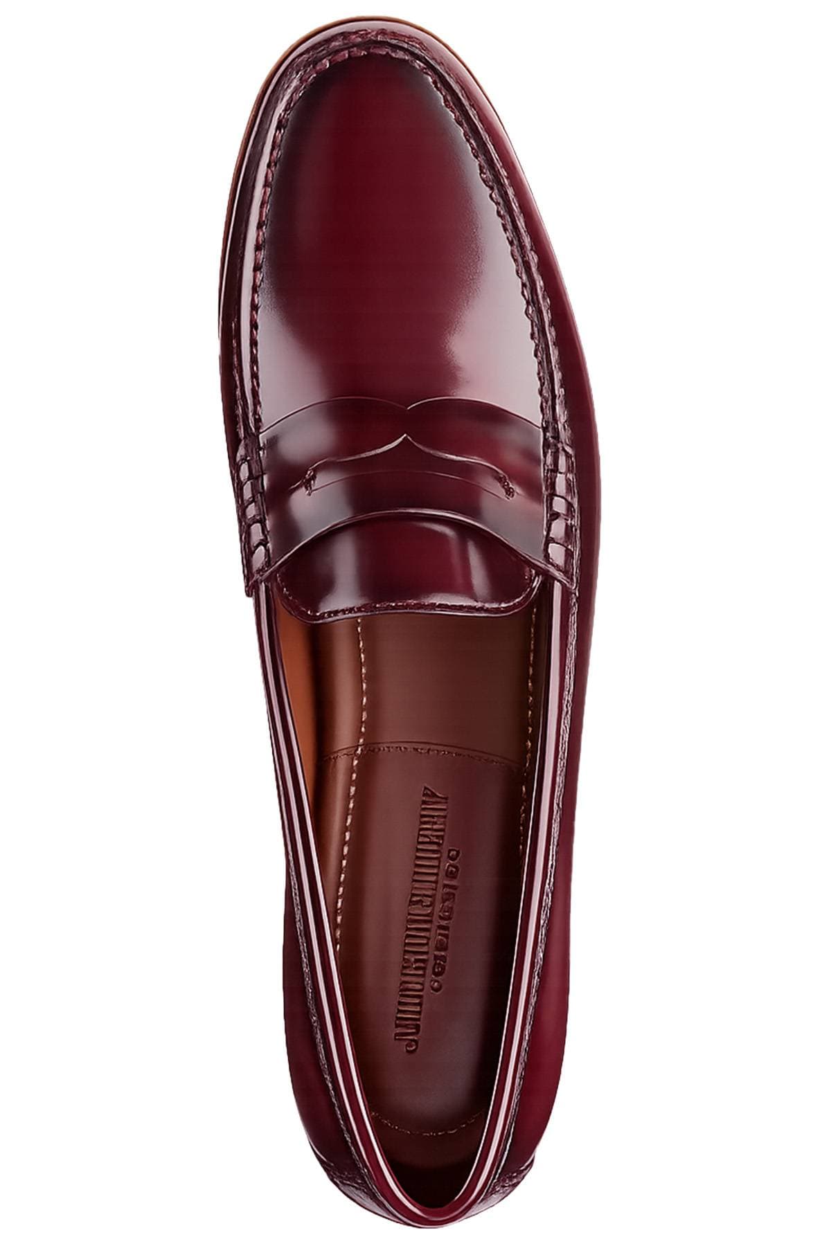 A top view of a glossy burgundy penny loafer.