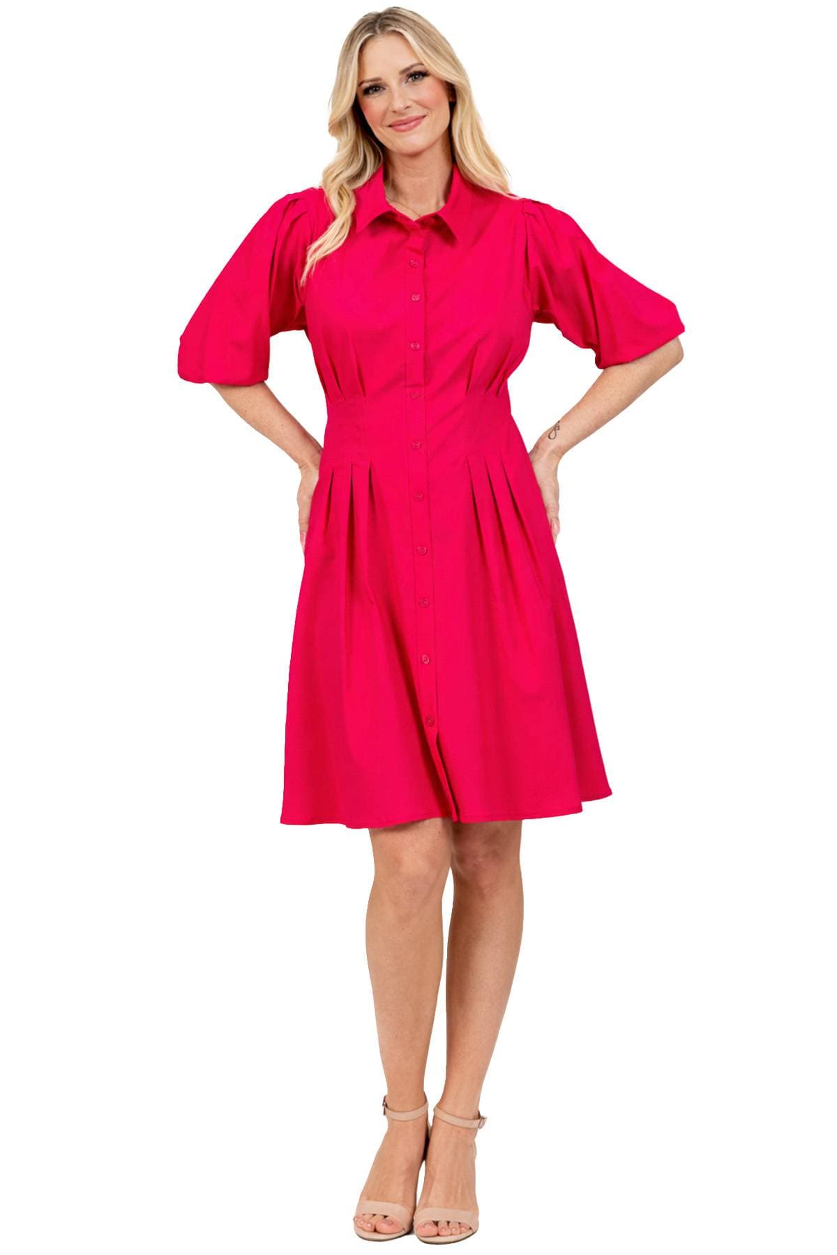 A person is wearing a bright pink collared dress with short puff sleeves and beige heels.