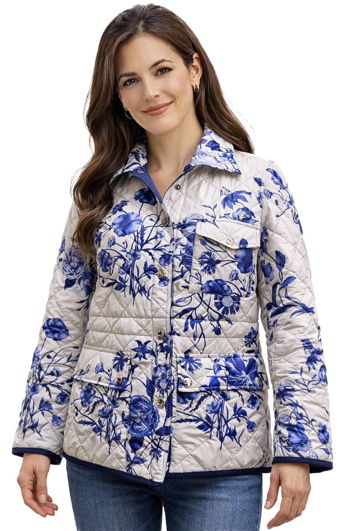 A person wearing a quilted jacket with a blue floral pattern.