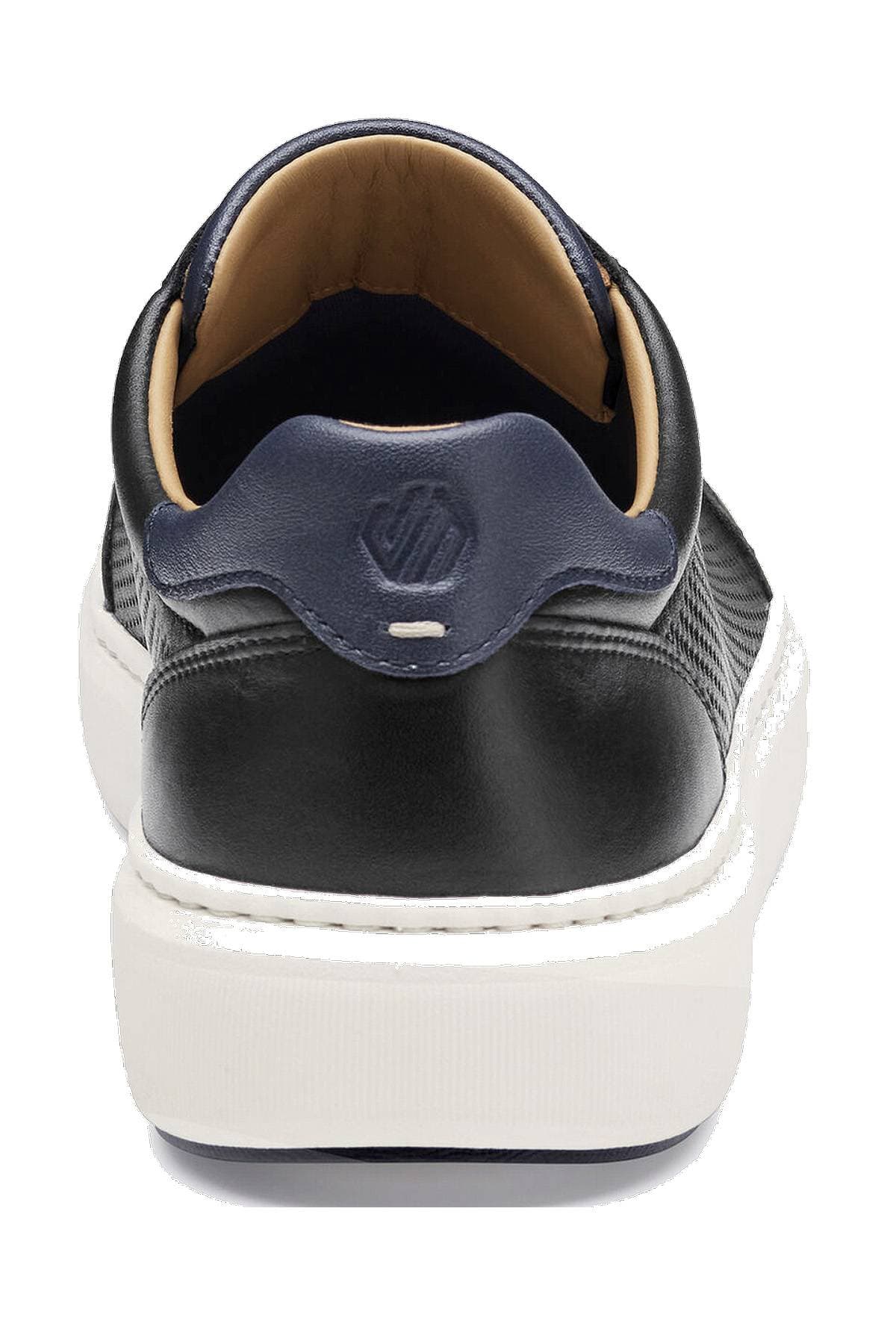 A black and white sneaker viewed from the back, featuring a blue heel tab with a logo.