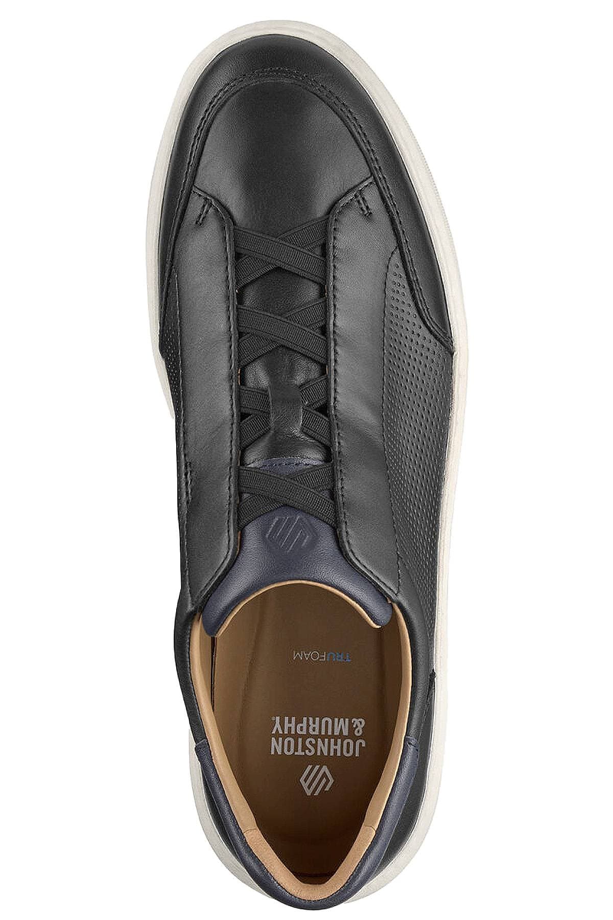Top view of a black leather sneaker with laces and a contrasting white sole.