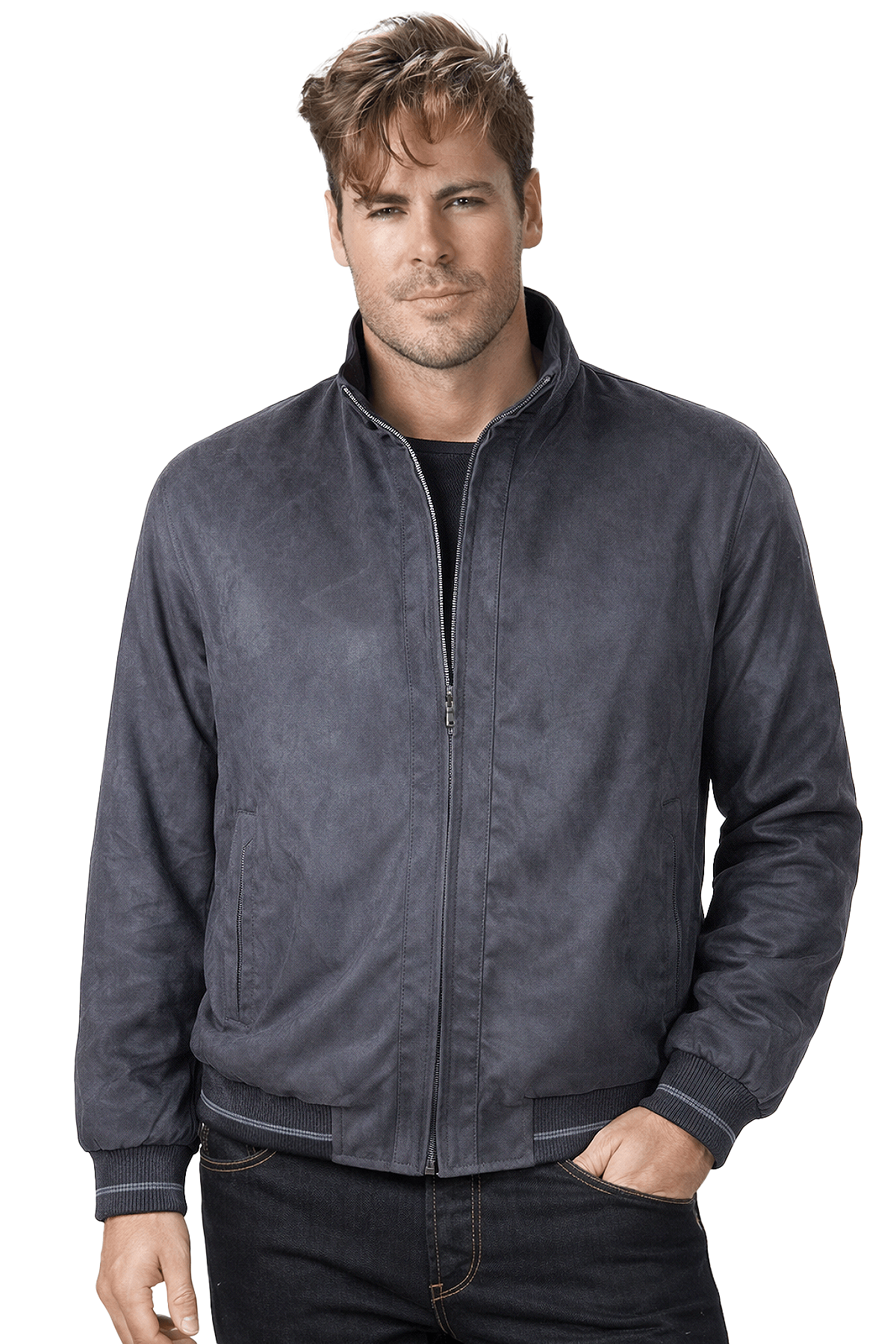 A man wearing a dark grey zip-up jacket stands with his hand in his pocket.