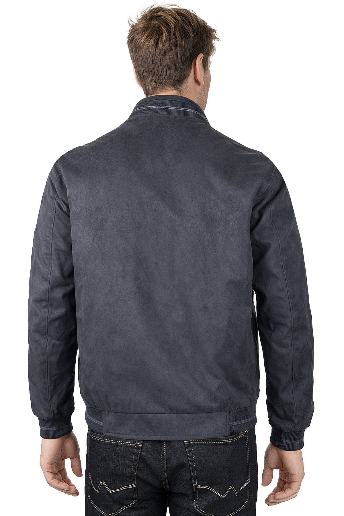 A man is wearing a dark jacket, viewed from behind.