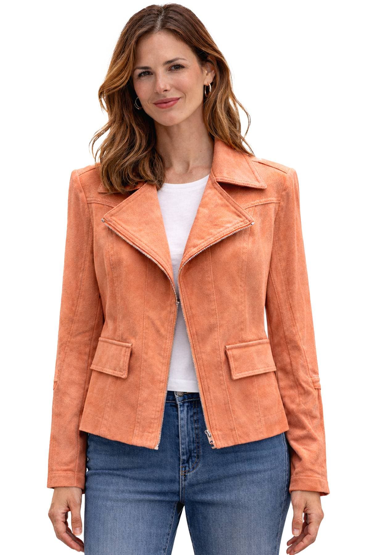 A woman wearing an orange jacket over a white shirt and blue jeans.