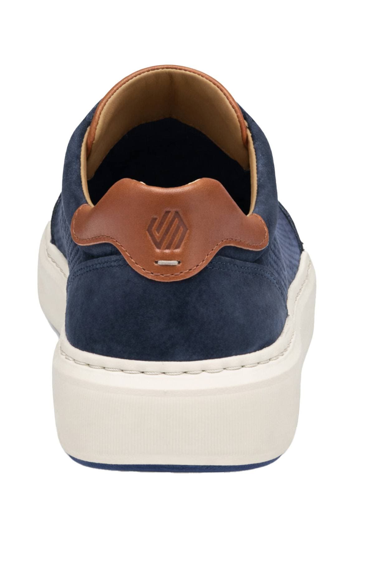 A navy blue sneaker with a brown leather accent on the heel and a white sole.