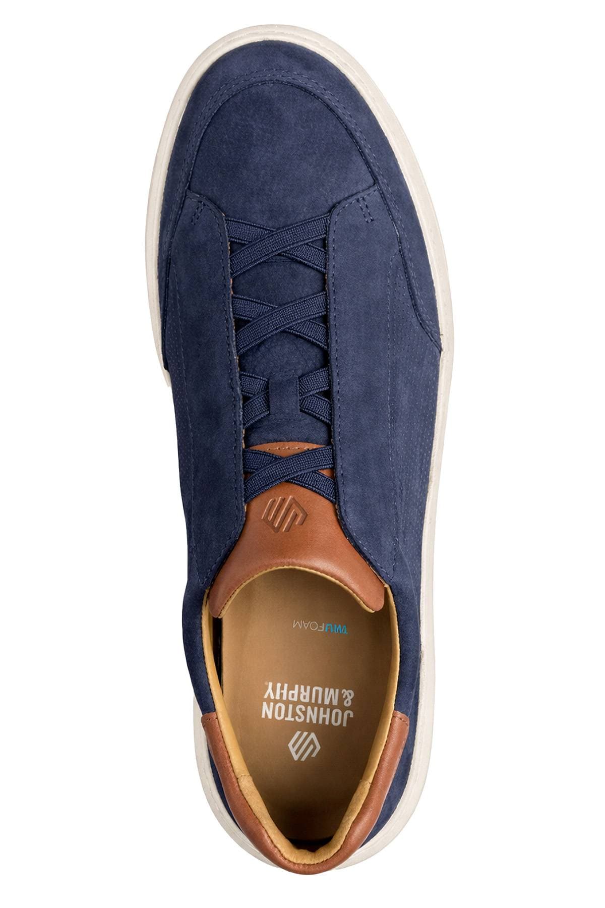 A navy blue sneaker with brown leather accents and a white sole.