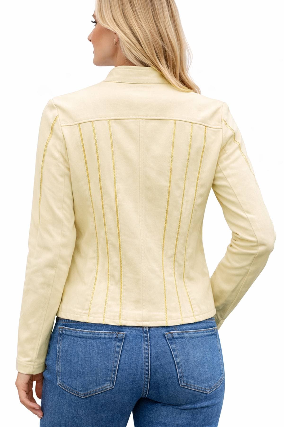 A woman with long blonde hair wearing a light yellow jacket and blue jeans is shown from the back.