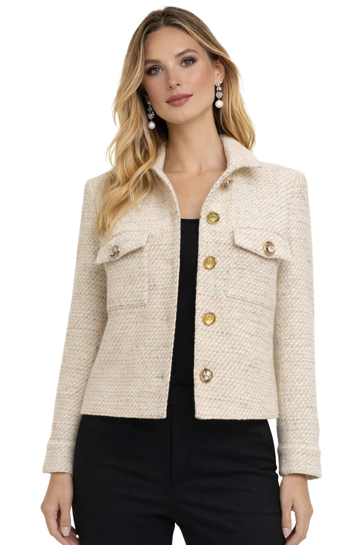 A woman wearing a beige textured jacket with large decorative buttons and pearl earrings.