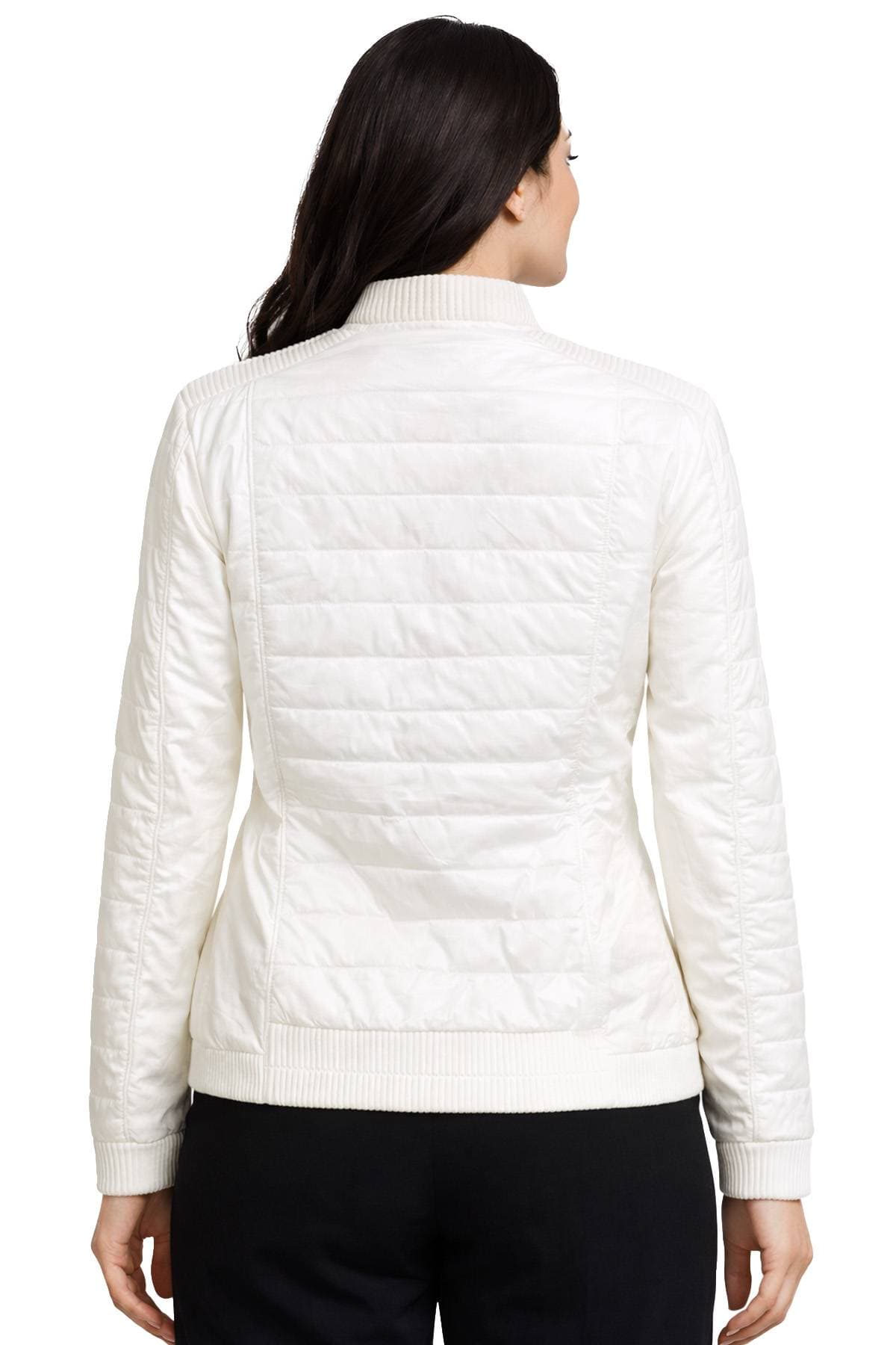 A person is wearing a white quilted jacket viewed from the back.