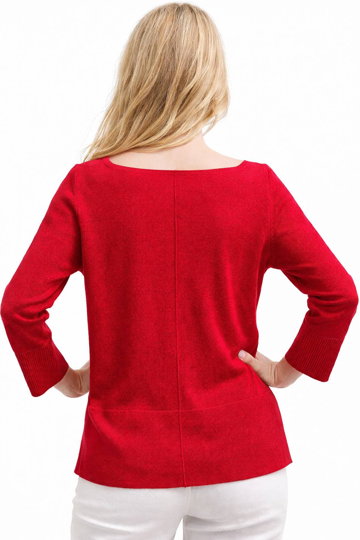 A person with blonde hair is wearing a red long-sleeve sweater, viewed from behind.