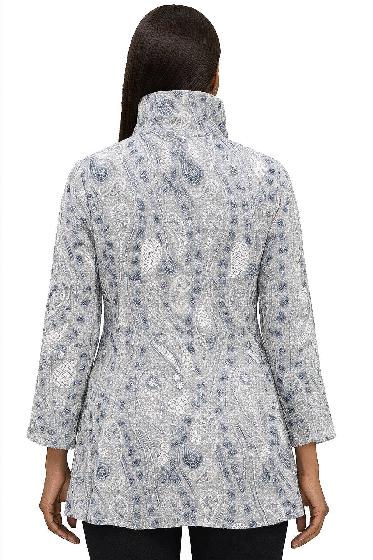 A person wearing a light gray, paisley-patterned jacket with a high collar is shown from the back.