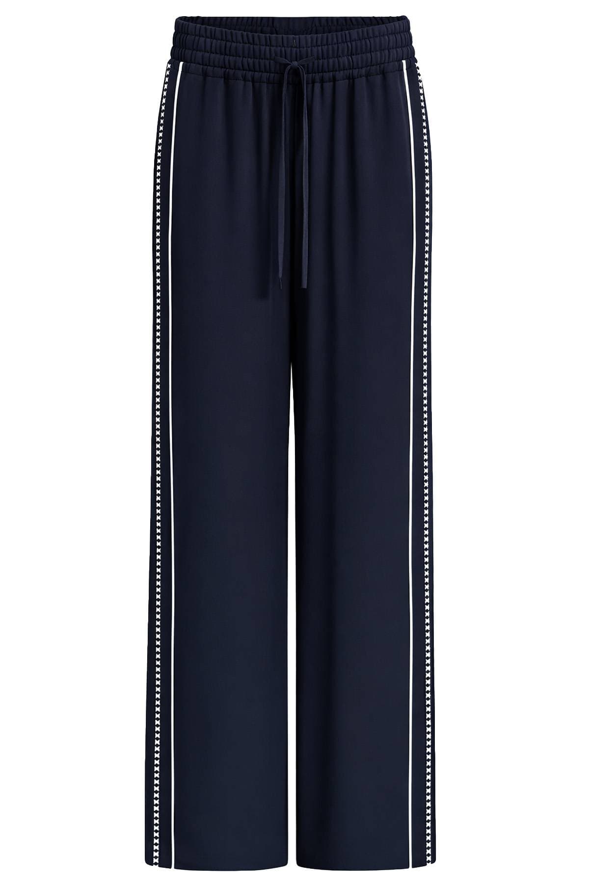 Navy wide-leg pants with white side stripes and a drawstring waist.