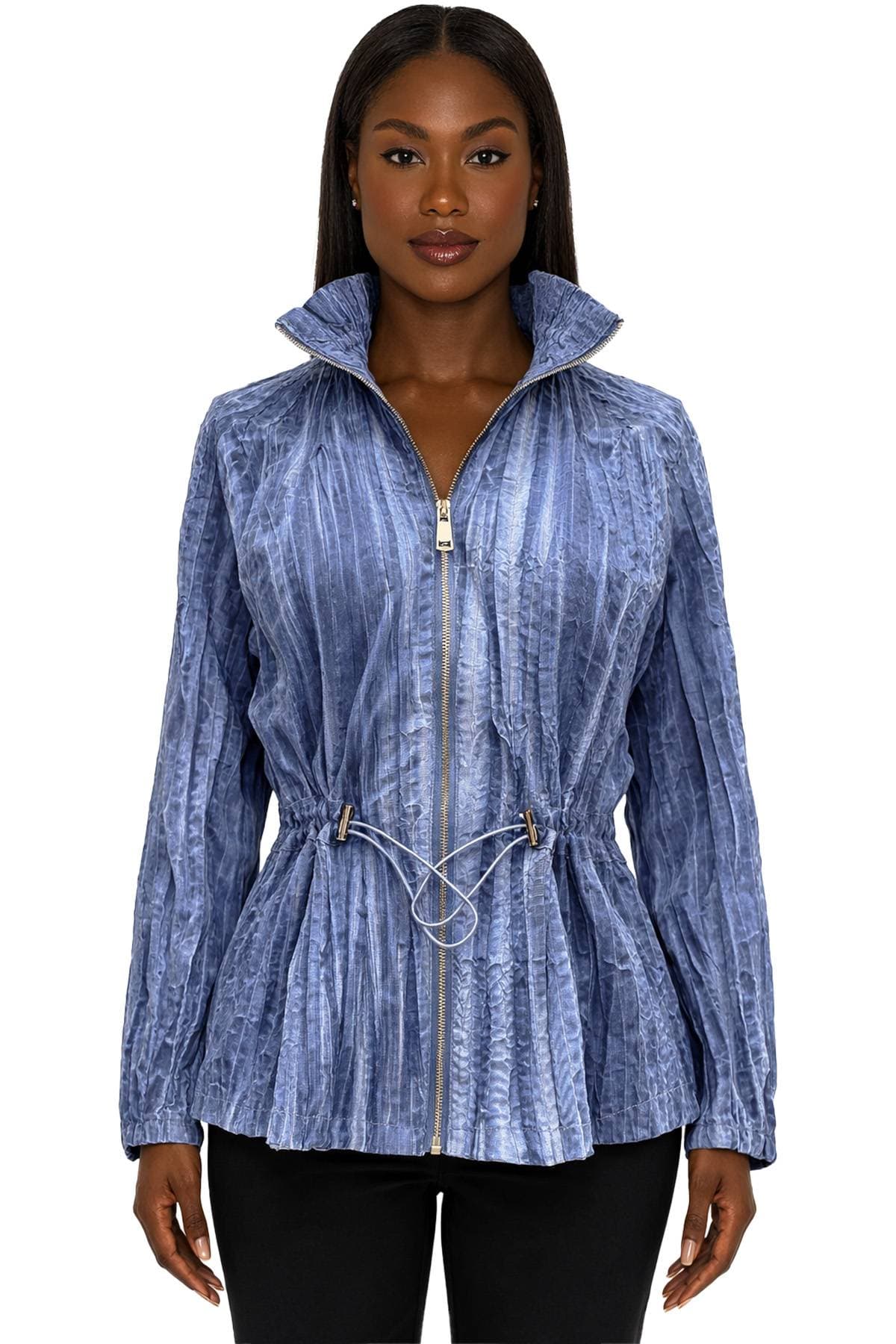 A woman wearing a textured blue jacket with a drawstring waist.