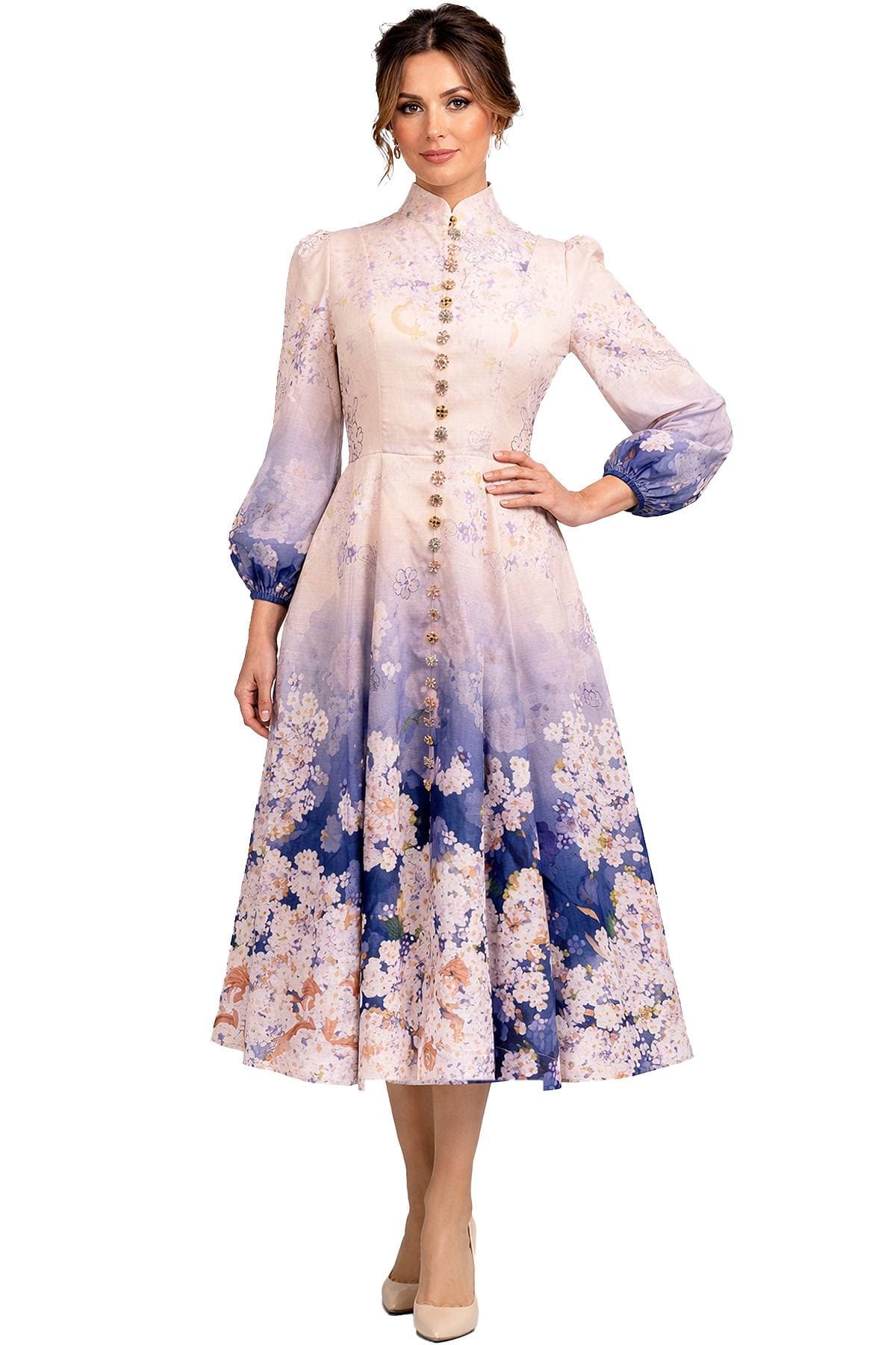 A woman wearing a long-sleeved dress with floral patterns and a high collar.