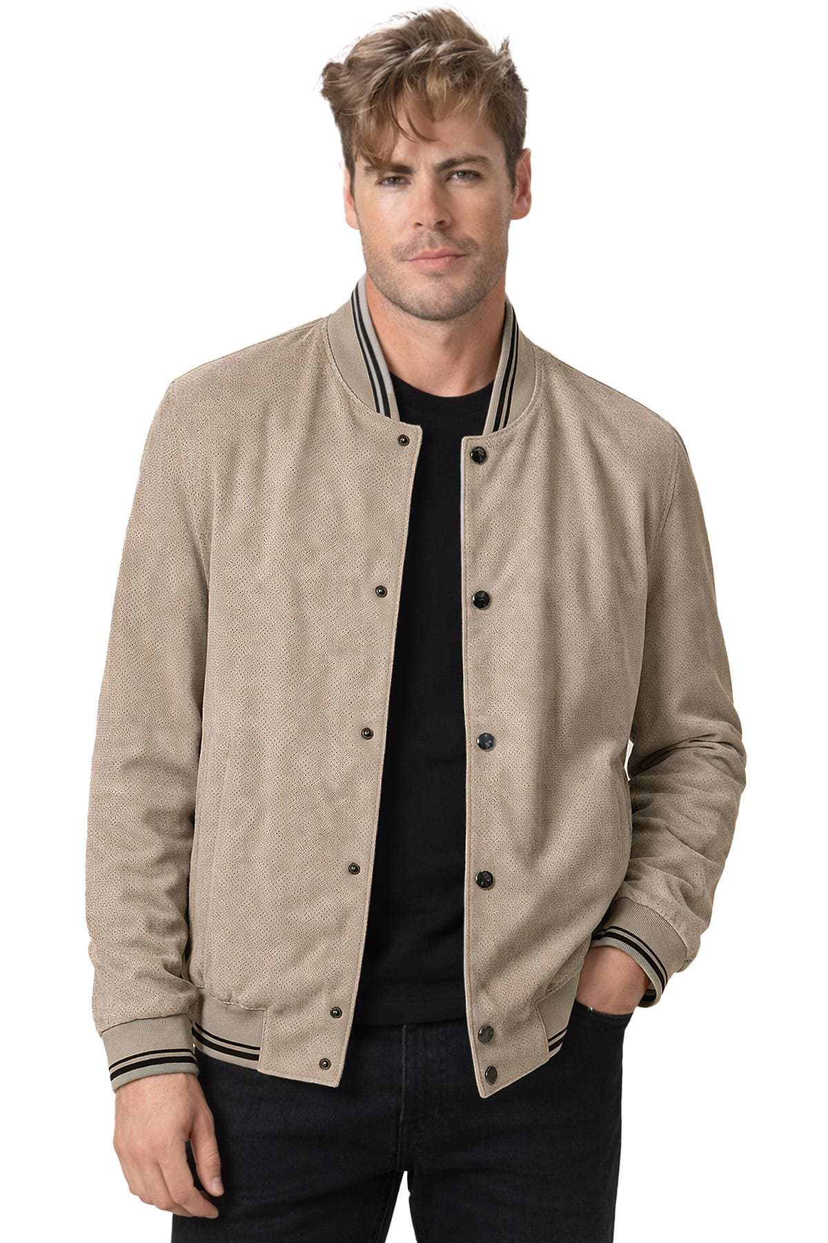 A man wearing a beige buttoned jacket over a black shirt.