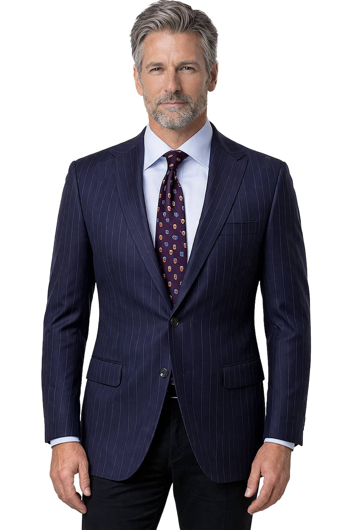 A man with gray hair and a beard is wearing a dark pinstripe suit with a patterned tie.