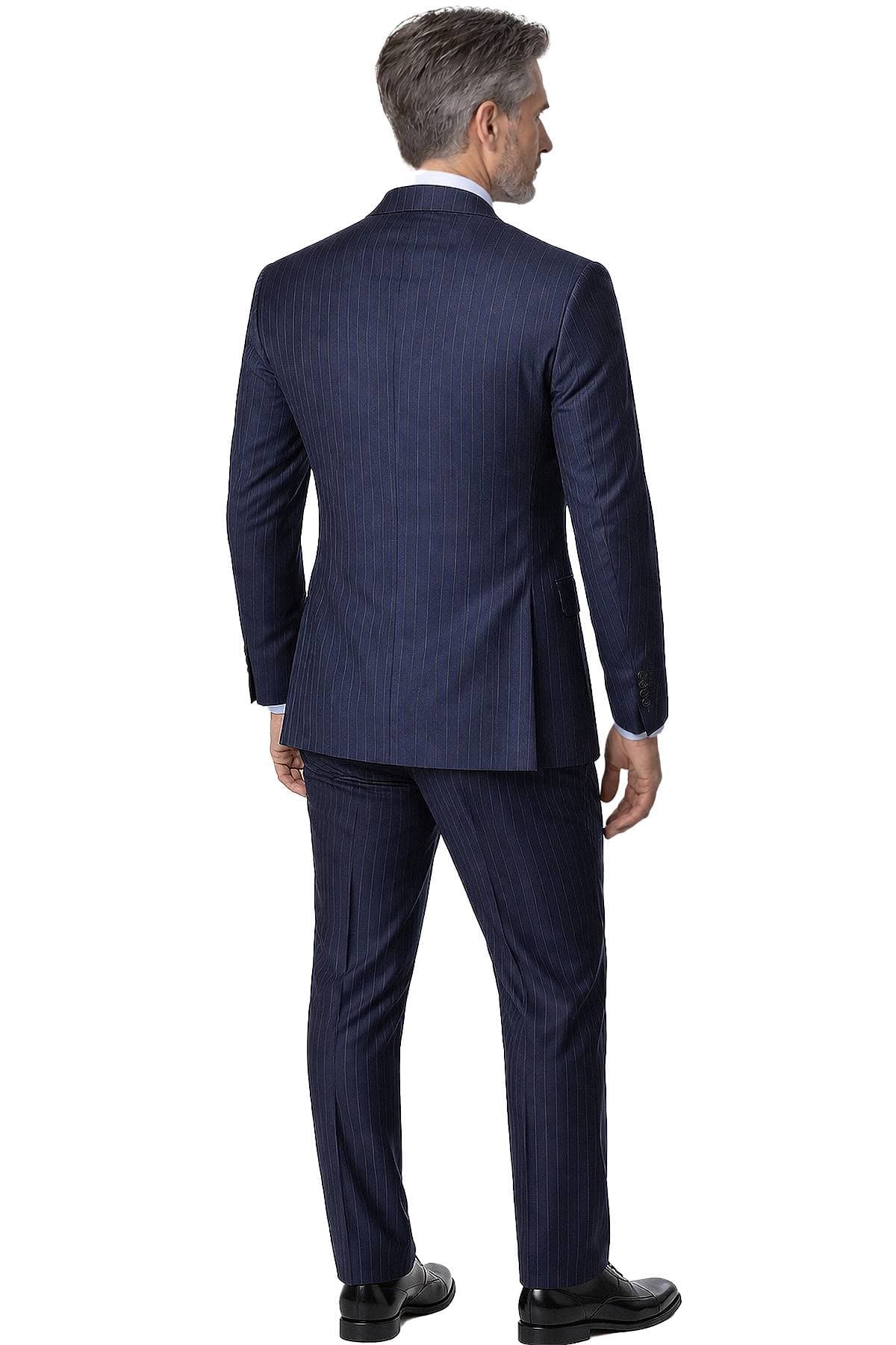 A man with gray hair is wearing a dark pinstripe suit and black shoes, shown from the back.