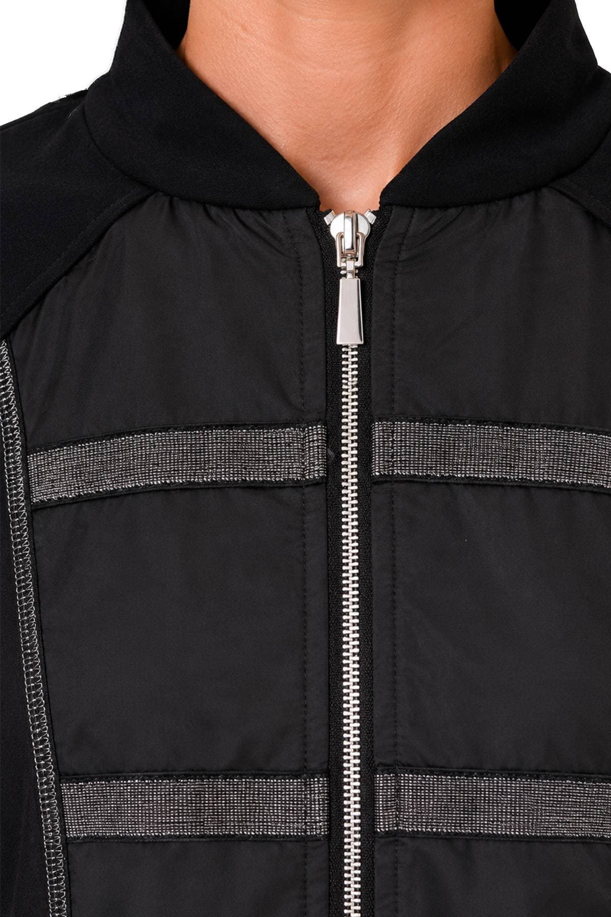 A close-up view of a black zip-up jacket with metallic horizontal stripes on the front.