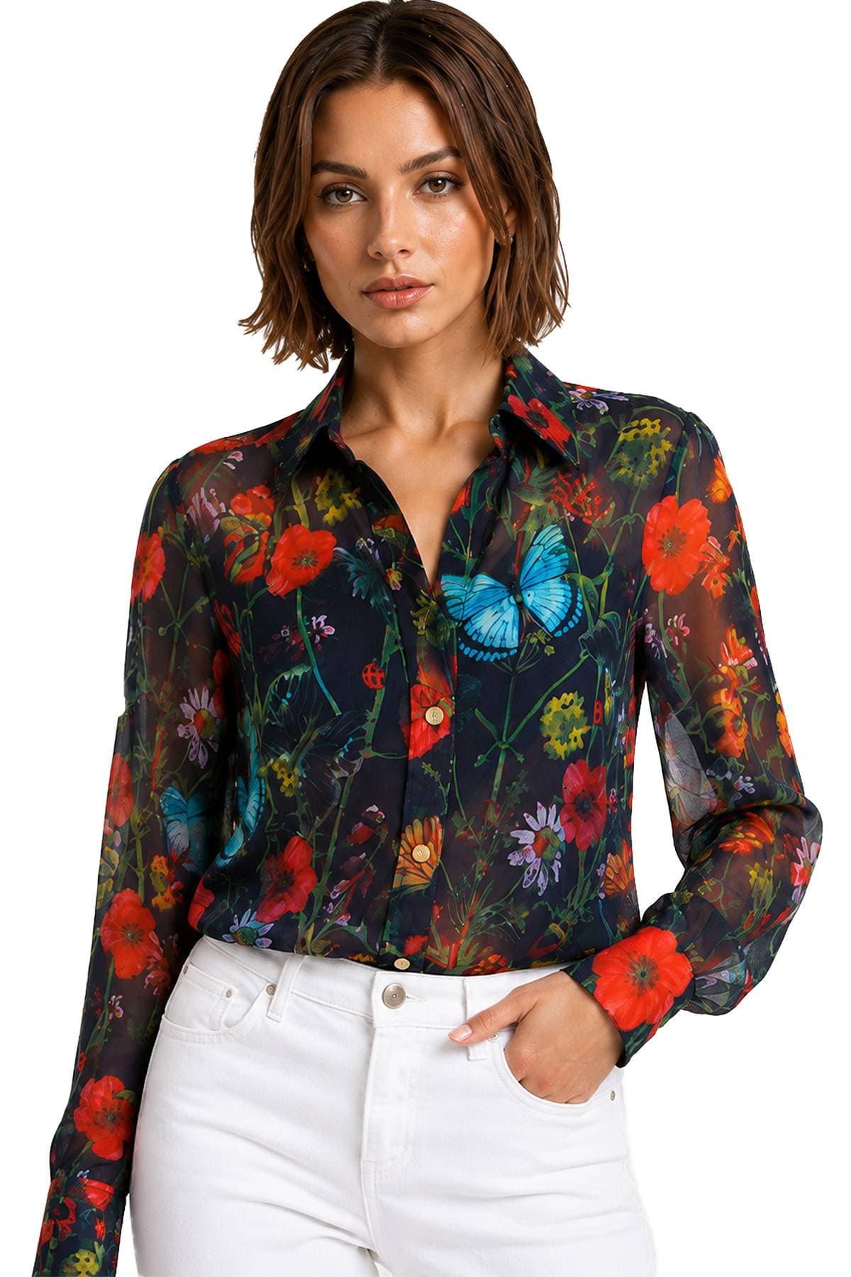 A person wearing a black sheer blouse with colorful floral and butterfly patterns, paired with white pants.
