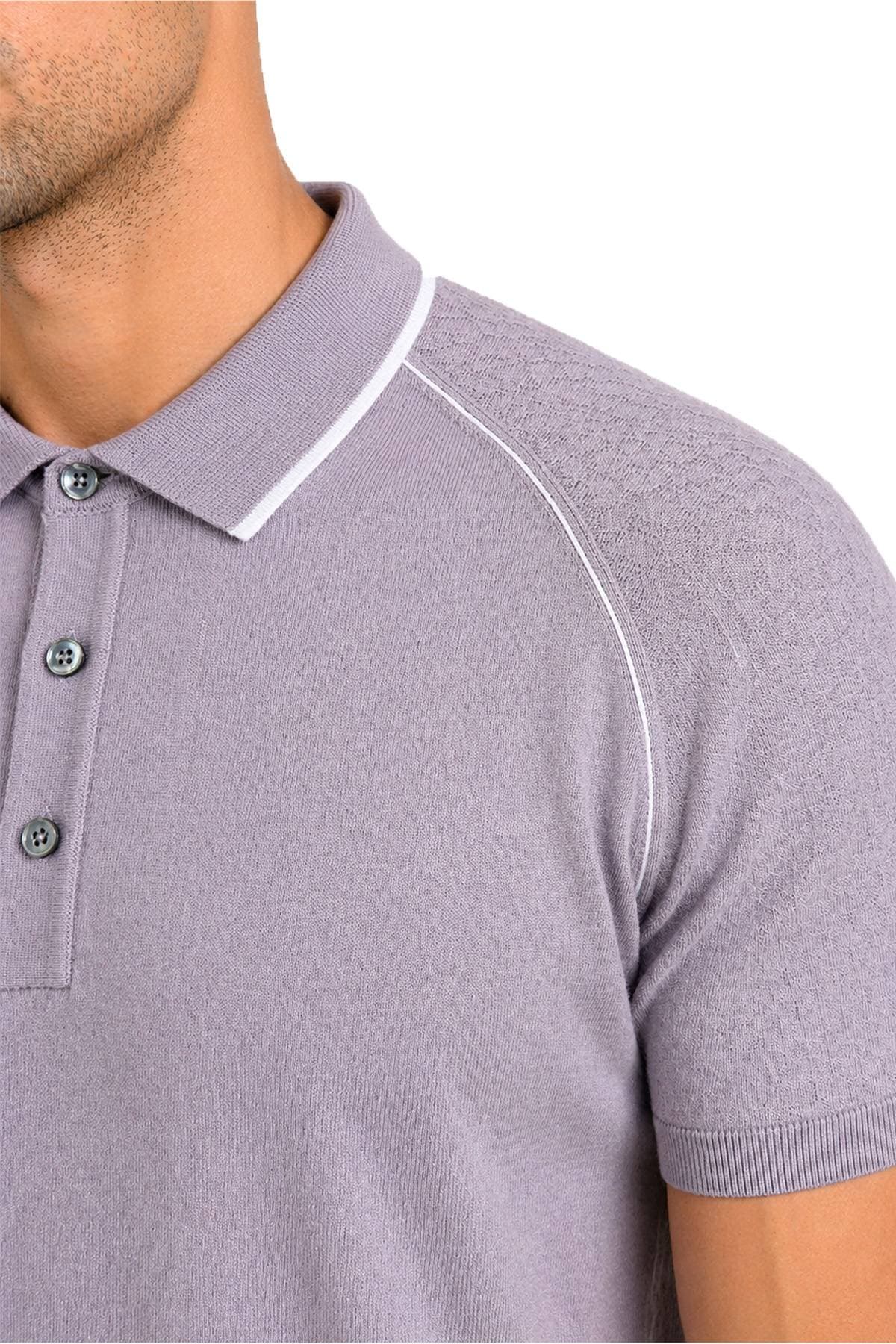 A close-up view of a person wearing a light purple polo shirt with white accents.