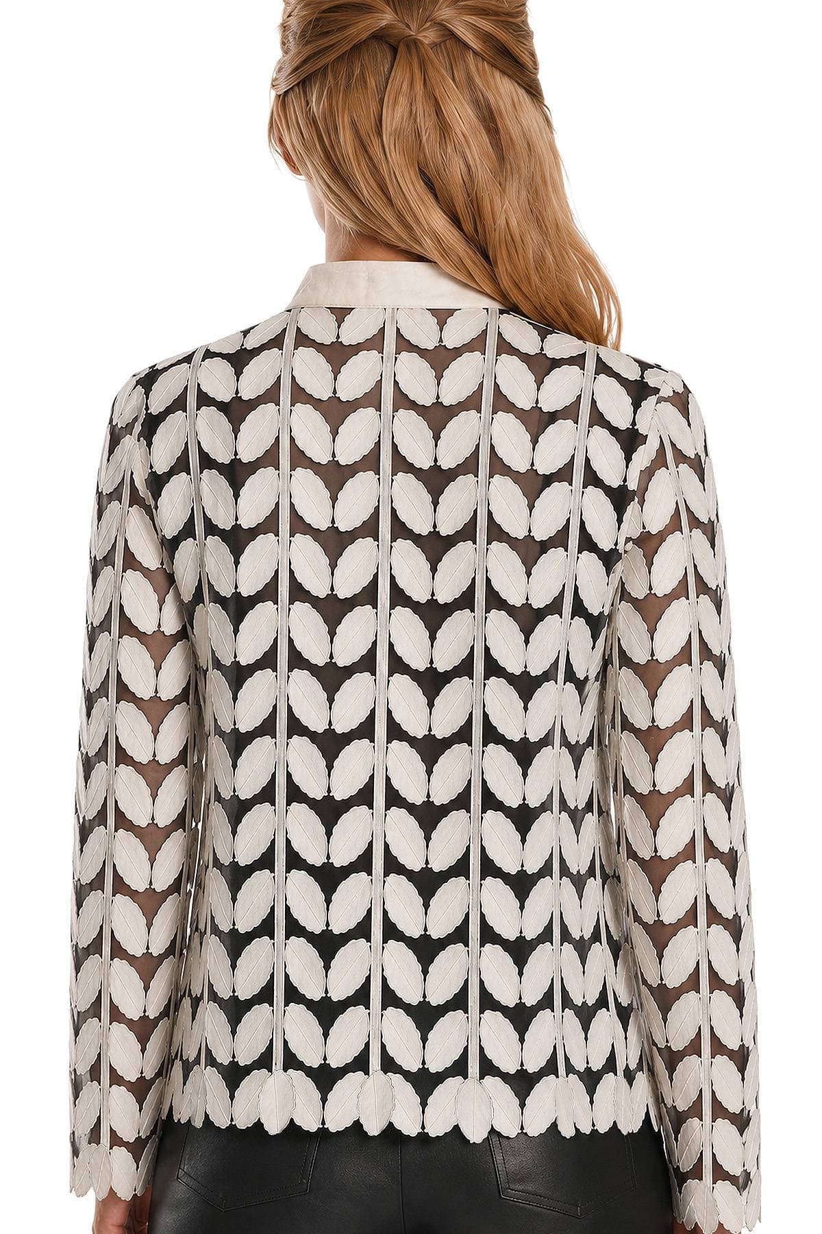 A person wearing a black and white patterned lace jacket is shown from the back.
