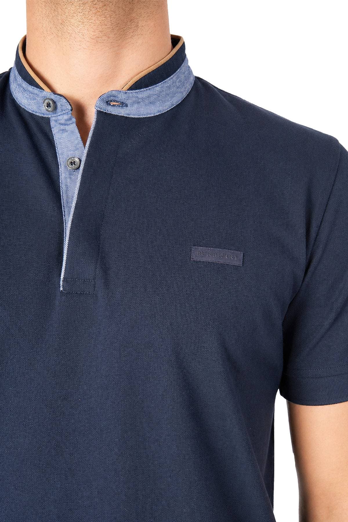 A person wearing a dark blue polo shirt with a light blue collar and button placket.