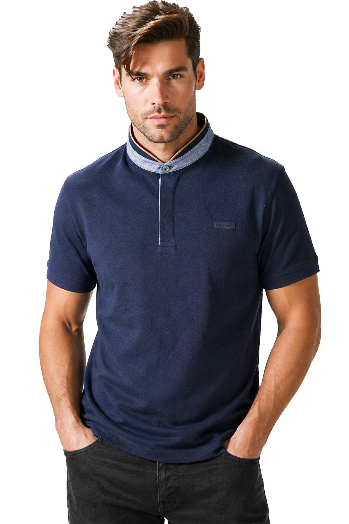 A man is wearing a dark blue short-sleeve polo shirt with a light blue collar and black jeans.