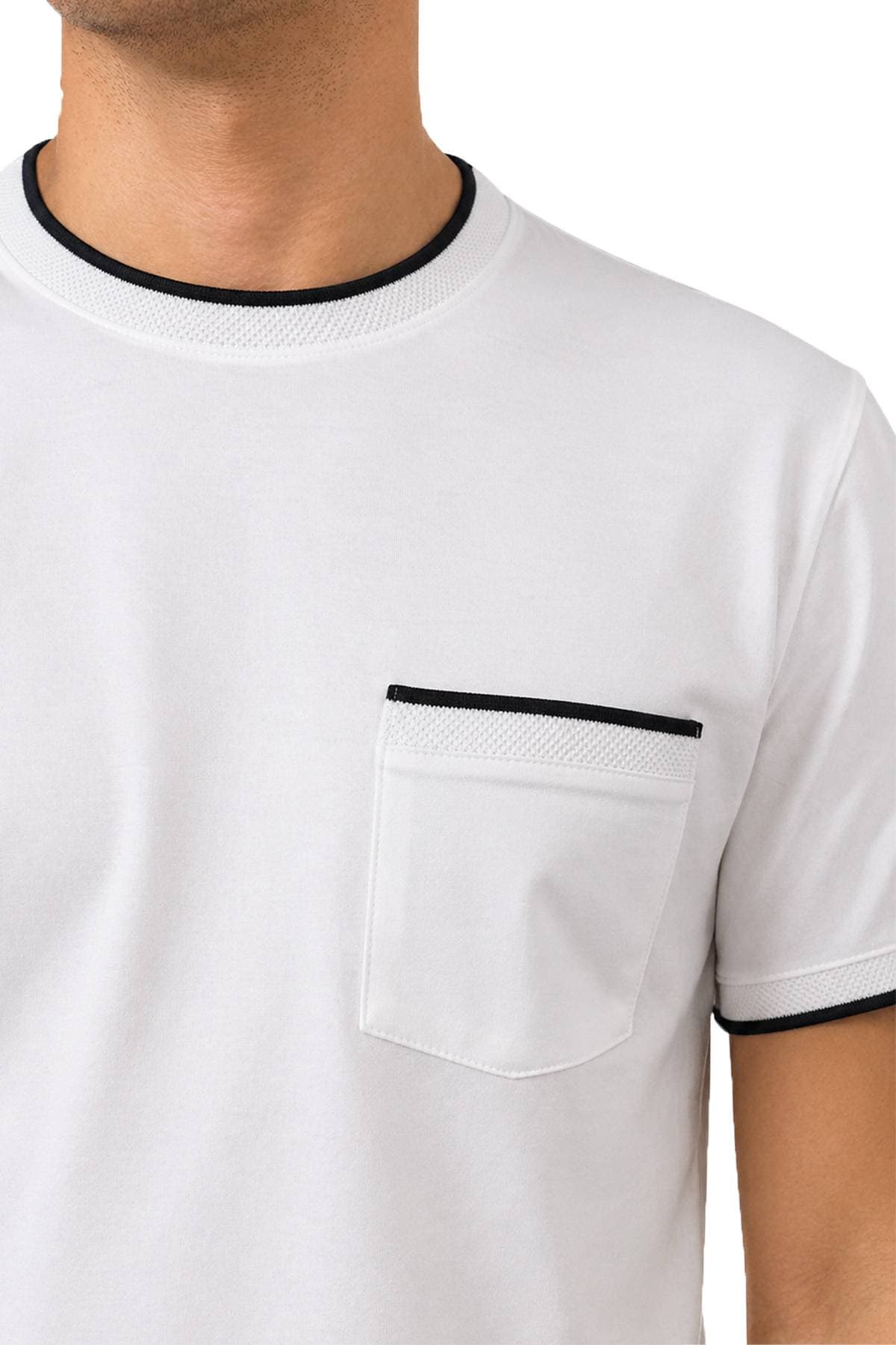A close-up of a person wearing a white T-shirt with black trimmed collar and pocket.