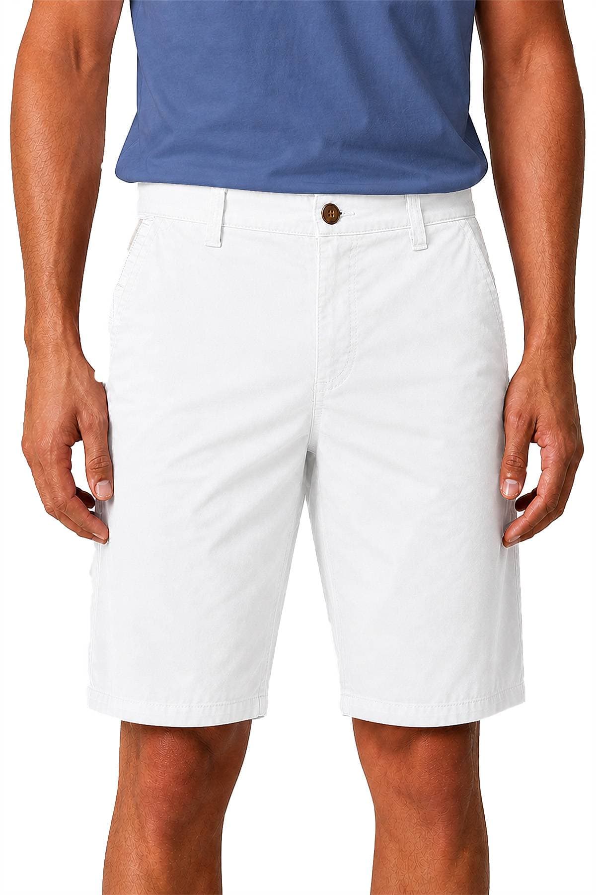 A person wearing a blue shirt and white shorts.