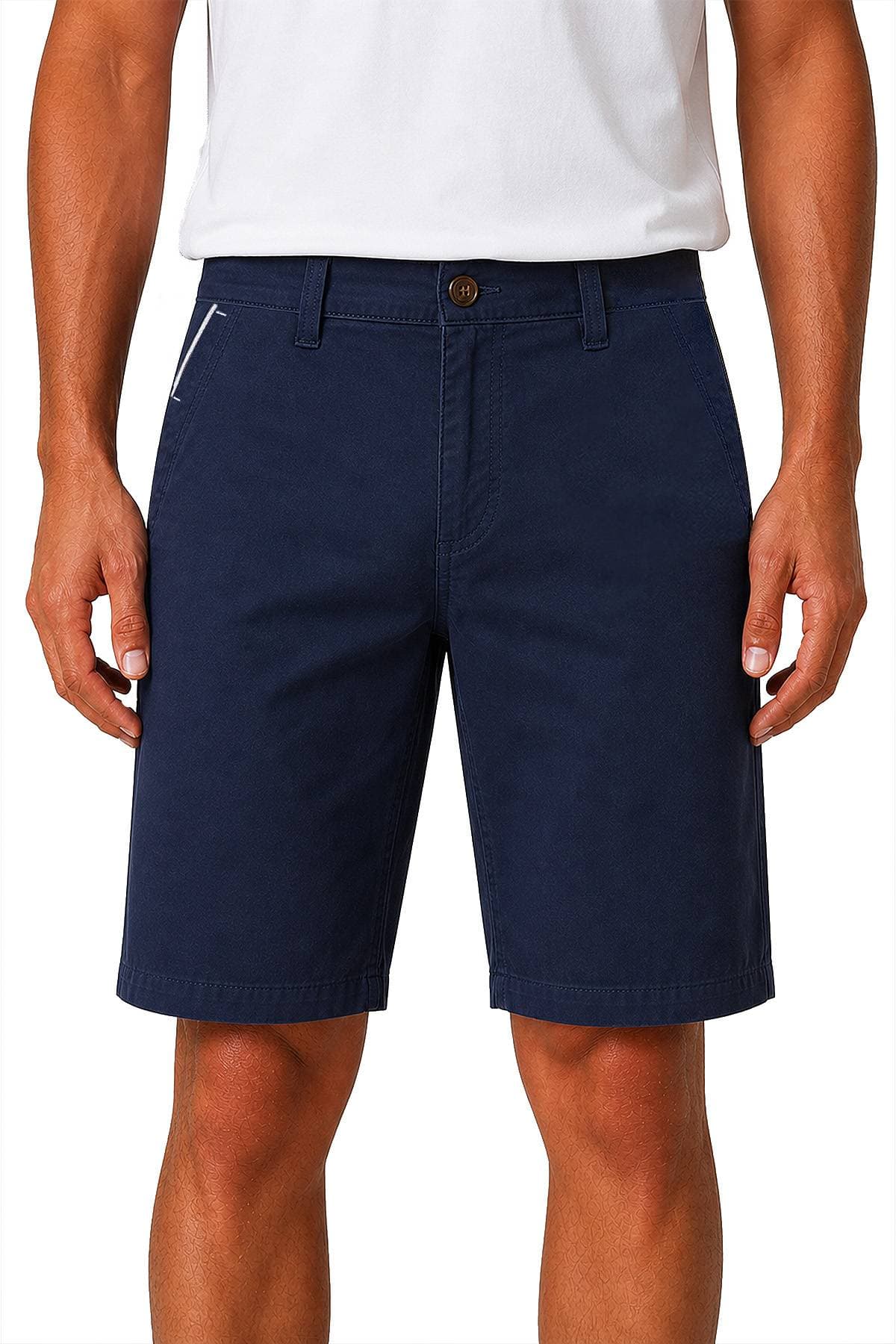 A person wearing a white t-shirt and navy blue shorts.