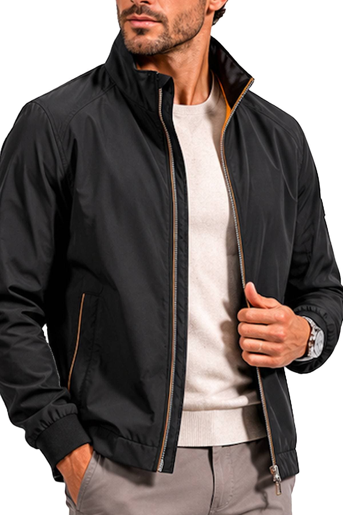 A man wearing a black zip-up jacket over a beige shirt.