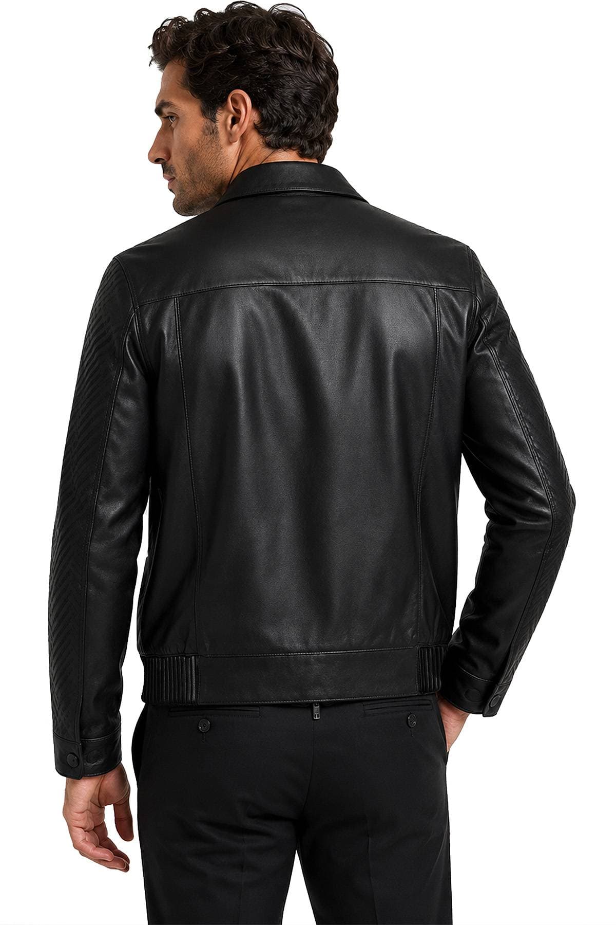 A man in a black leather jacket is shown from the back.