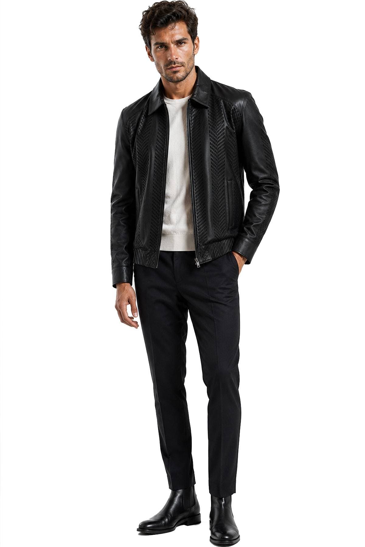 A man is wearing a black leather jacket, white sweater, black pants, and black boots.