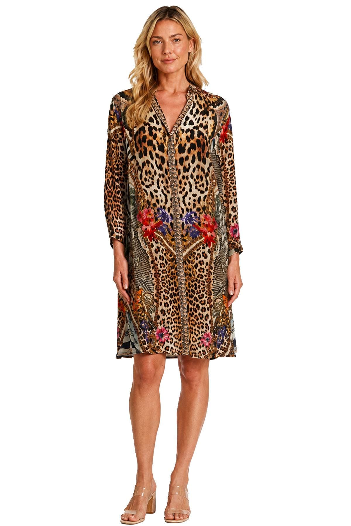 A person wearing a knee-length dress with a leopard print and floral patterns.