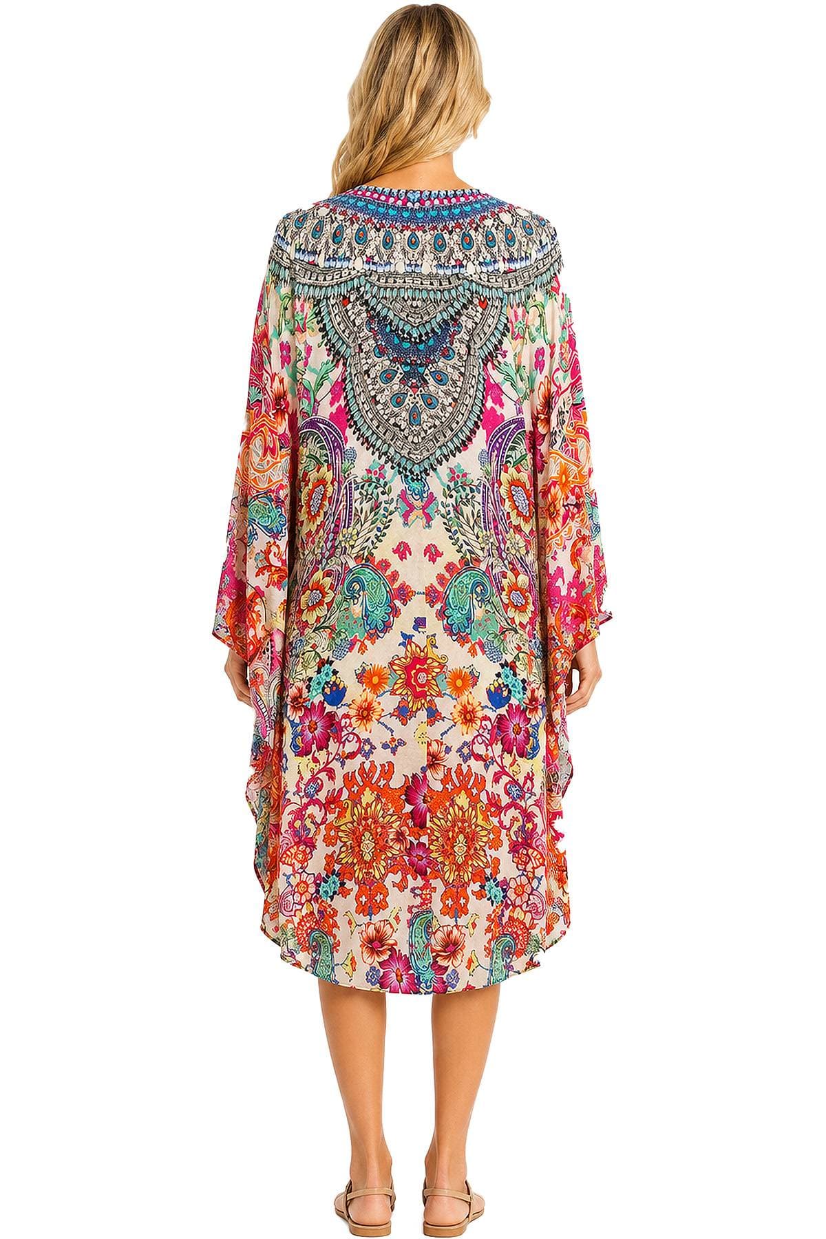 A person is wearing a colorful, intricately patterned kimono-style dress viewed from the back.