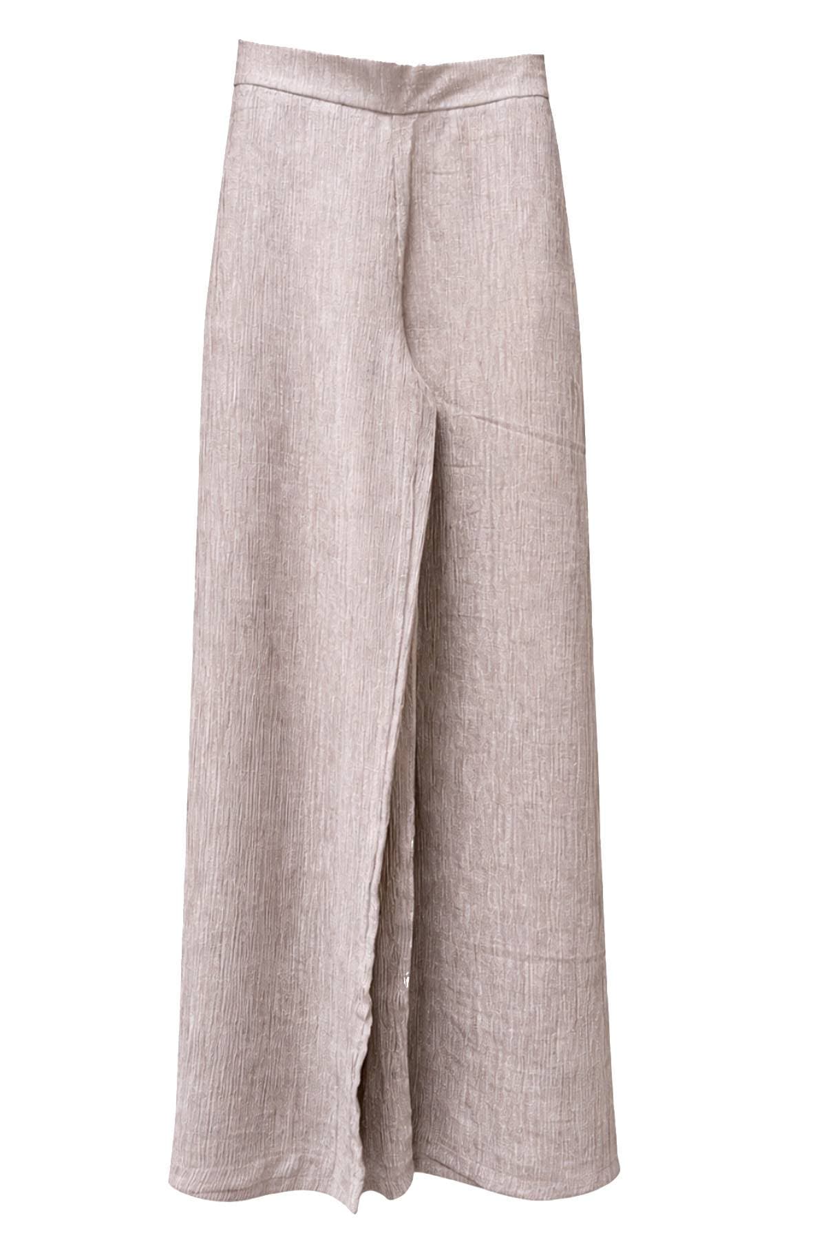 A pair of light brown, wide-leg, crinkle-textured pants.