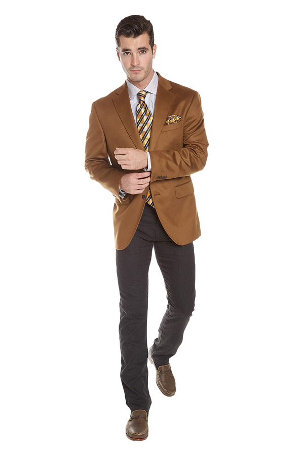 man in a light cocoa brown suit jacket